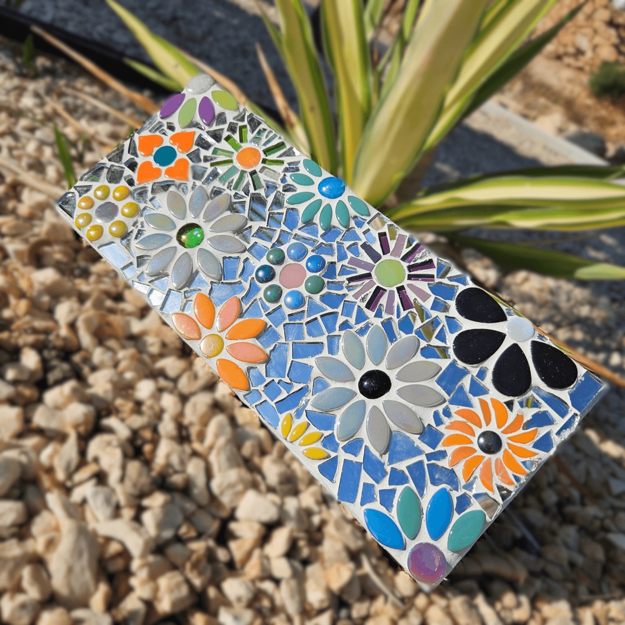 Mirrored mosaic flower tile.