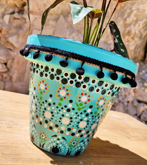 Decorative dotted plant-pot.