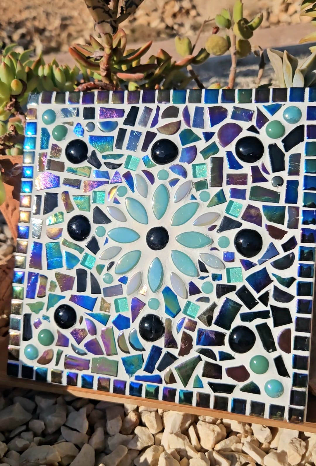 Turquoise mosaic flower tile.