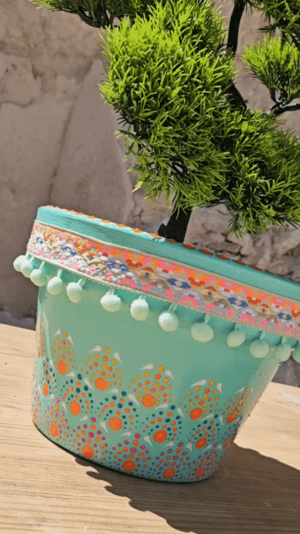 Decorative dotted plant-pot.
