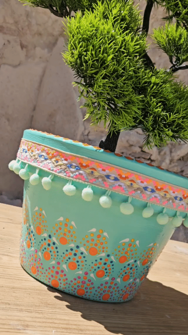 Decorative dotted plant-pot.