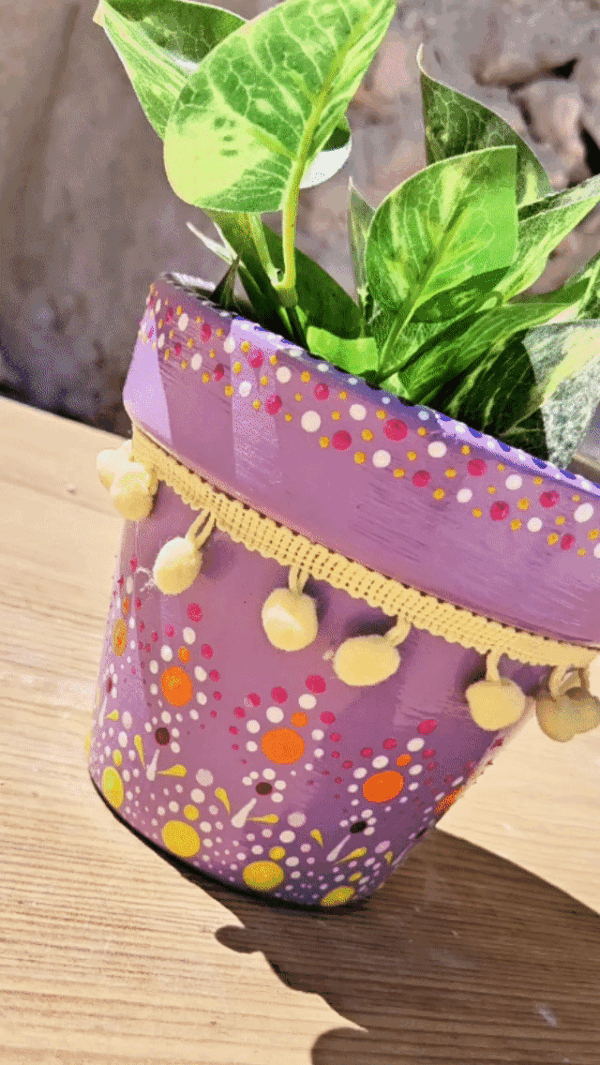 Decorative dotted plant-pot.