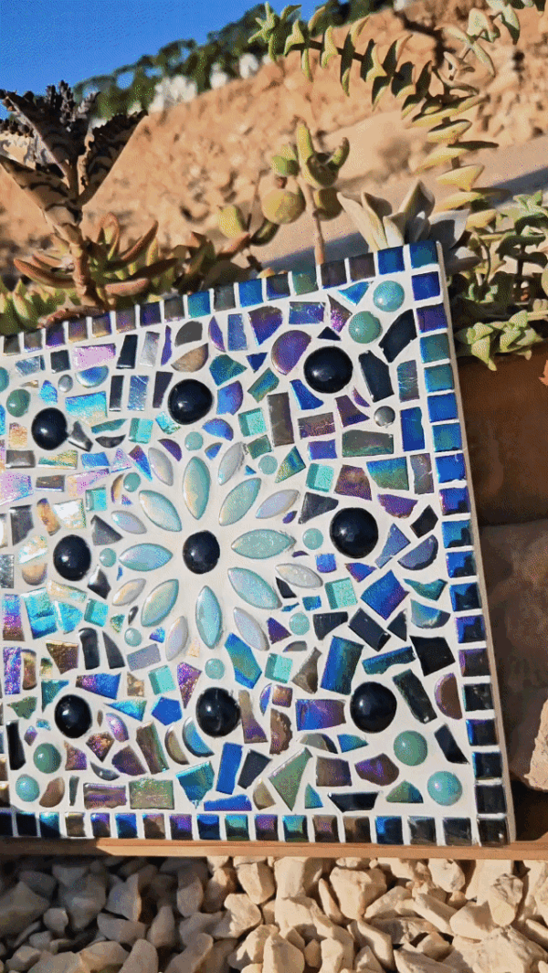Turquoise mosaic flower tile.