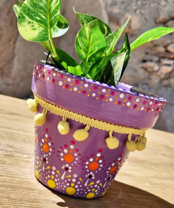 Decorative dotted plant-pot.