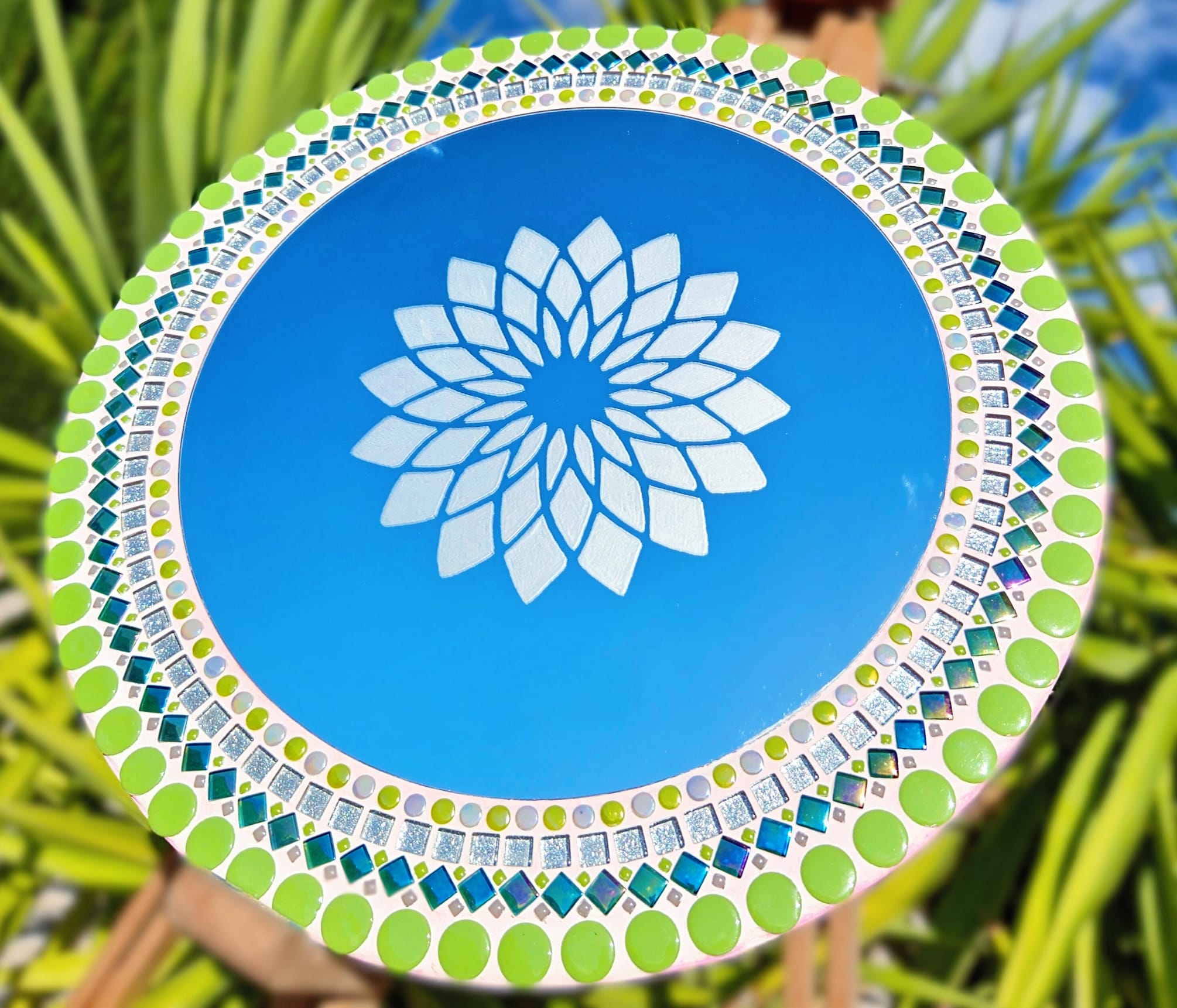 Colourful pink and green mosaic mirror with etched mandala.