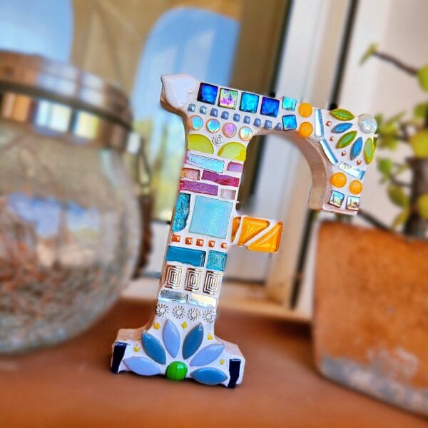 Decorative mosaic letter F.