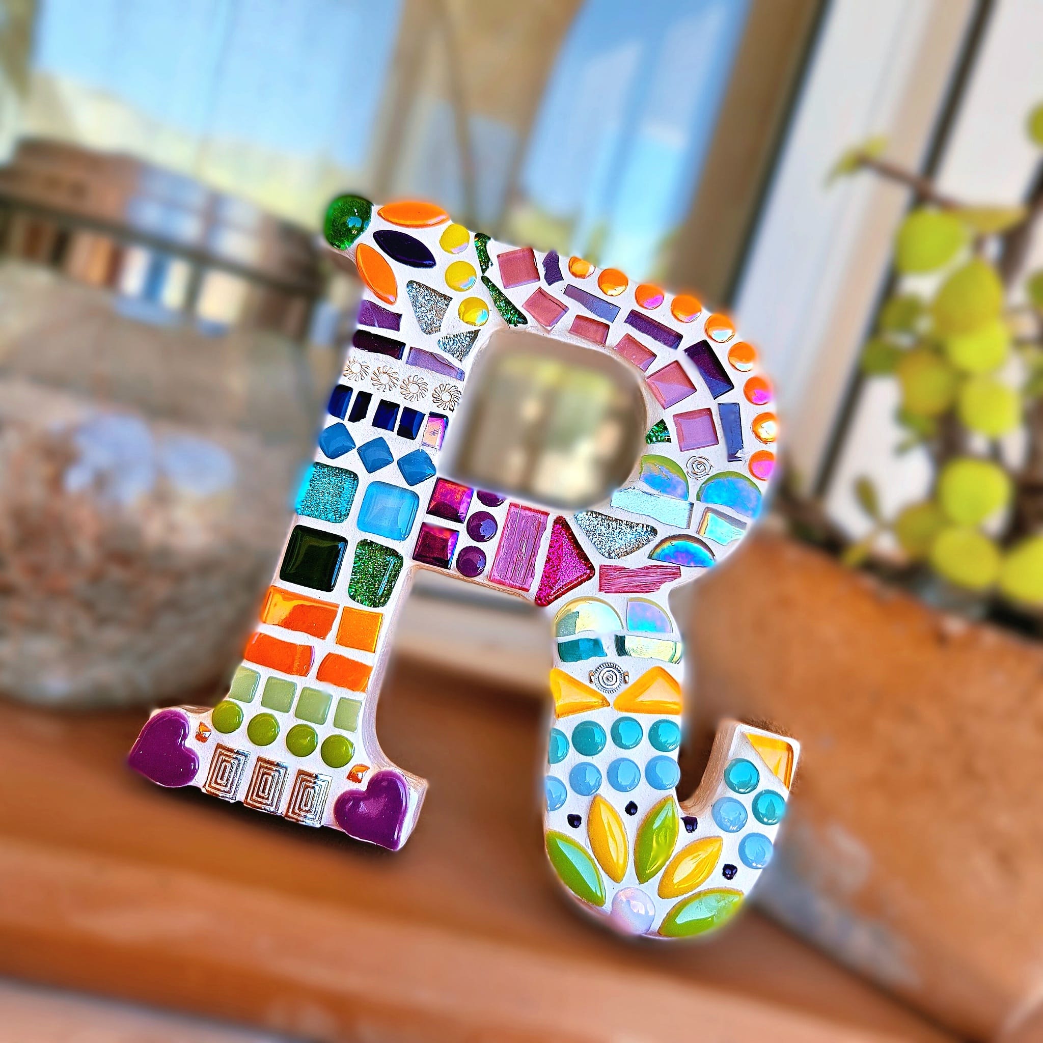 Decorative mosaic letter R.