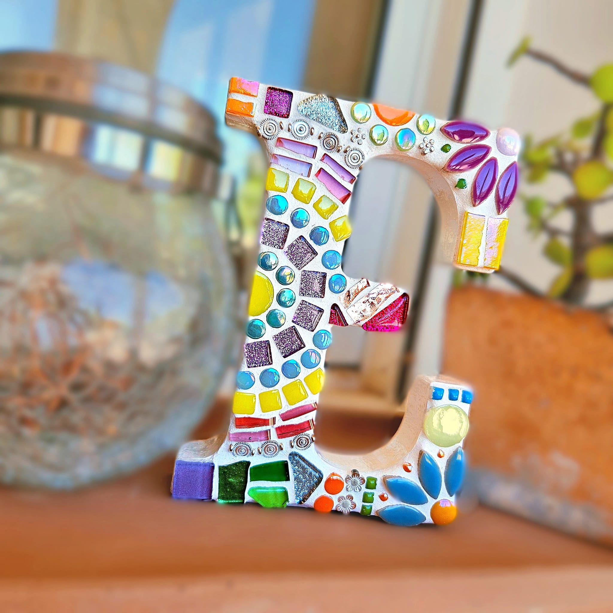 Decorative mosaic letter E.