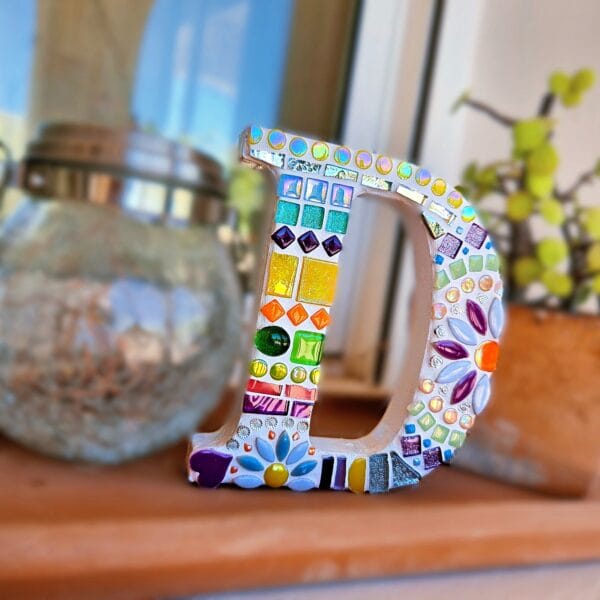 Decorative mosaic letter D.