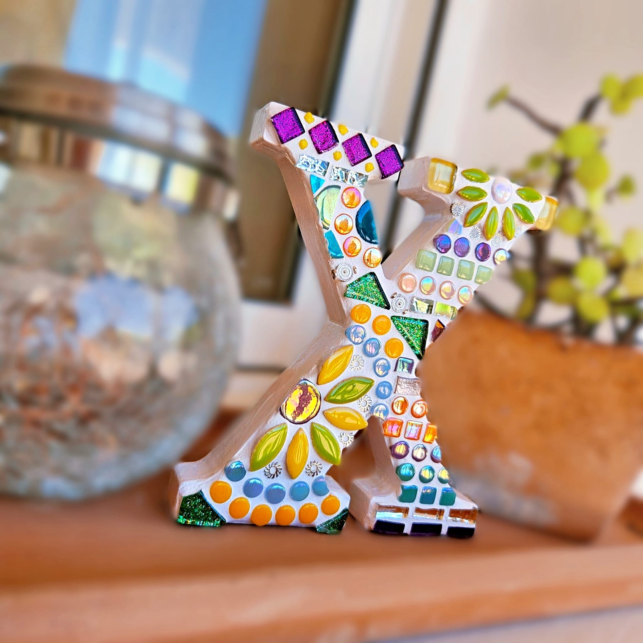 Decorative mosaic letter X.