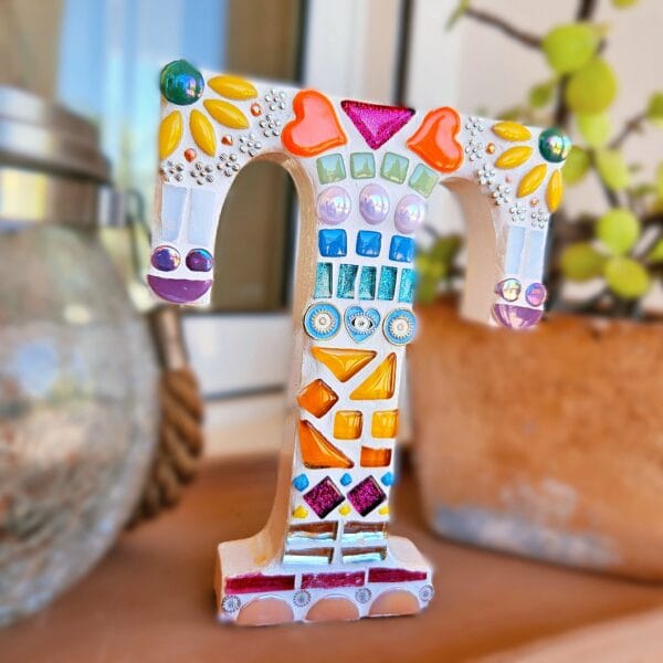 Decorative mosaic letter T.