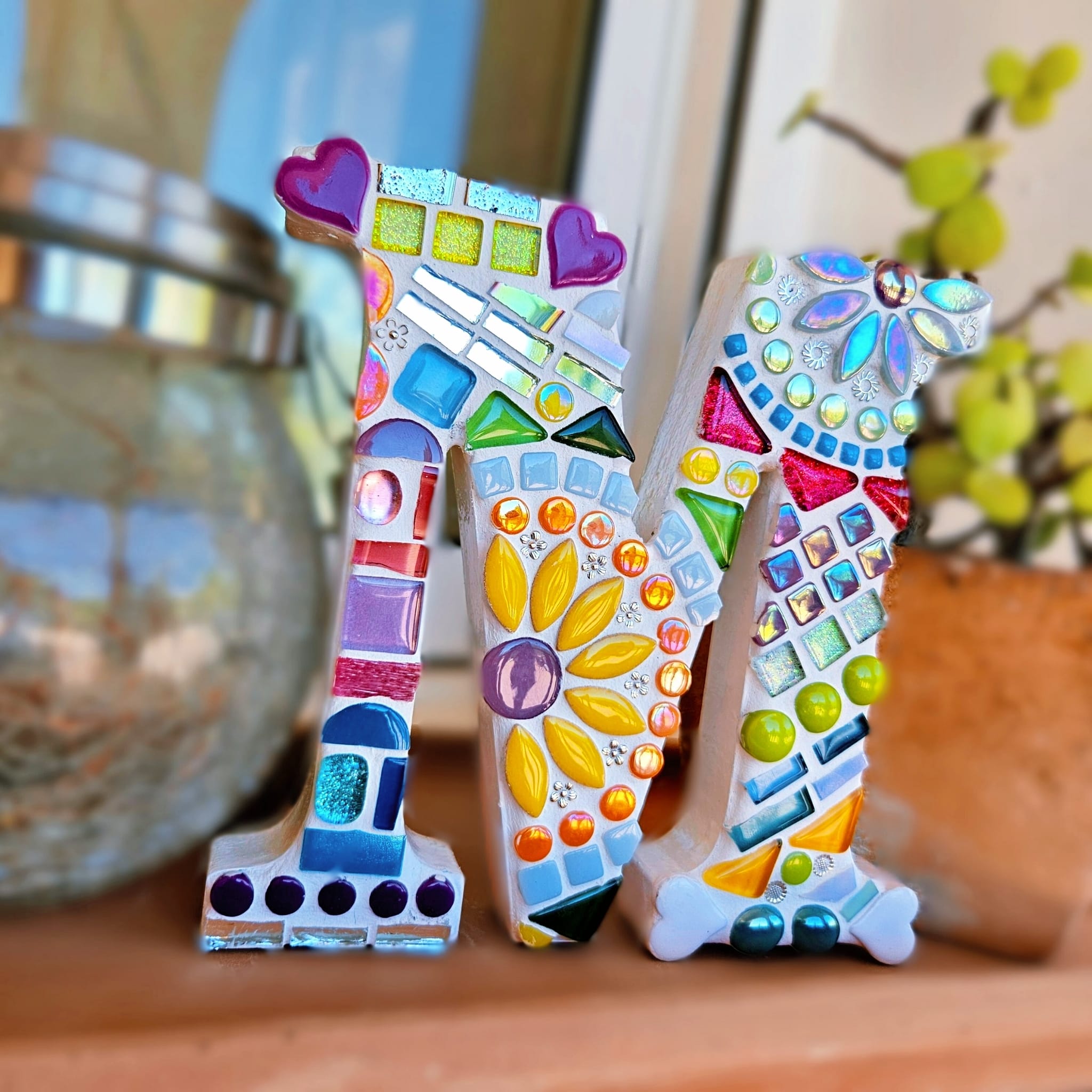 Decorative mosaic letter M.