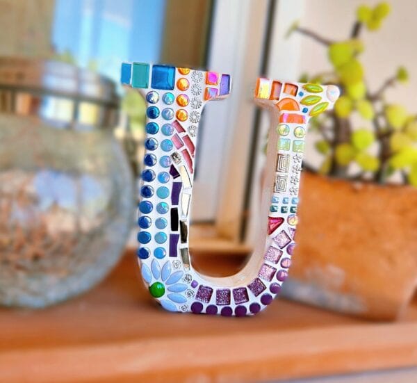 Decorative mosaic letter U.