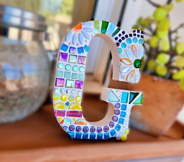 Decorative mosaic letter G.