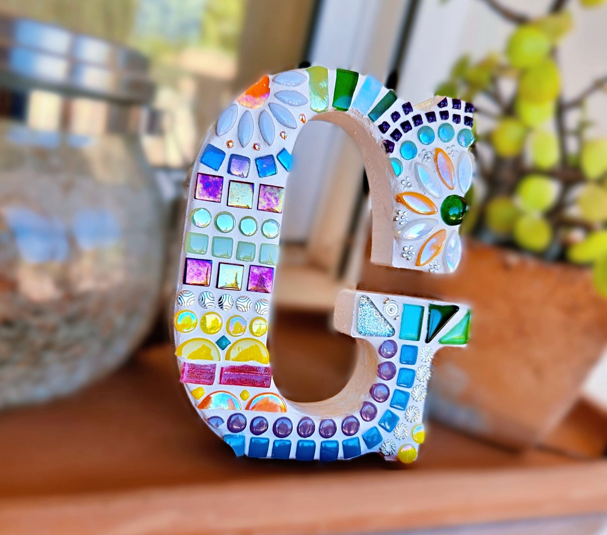 Decorative mosaic letter G.