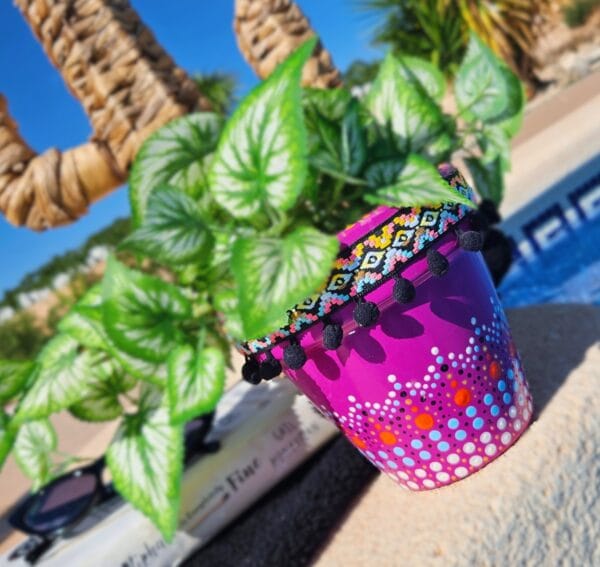 Decorative dotted plant-pot.