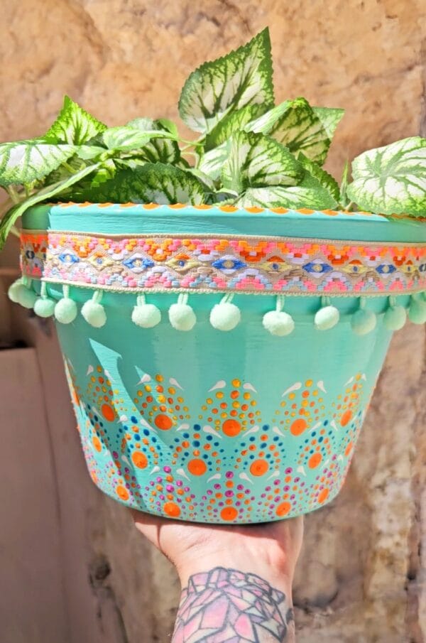 Decorative dotted plant-pot.
