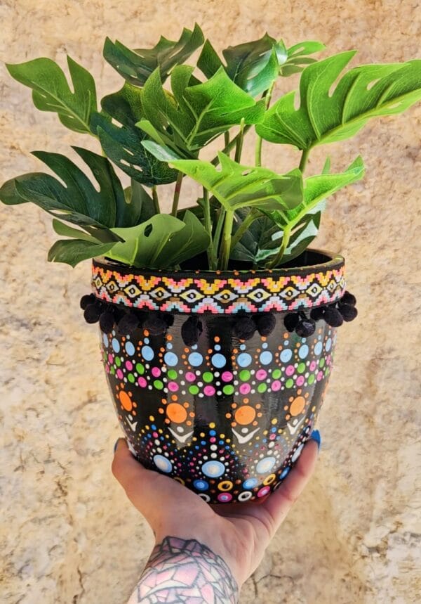 Decorative dotted plant-pot.