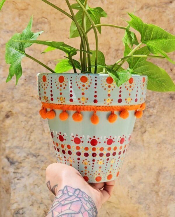 Decorative dotted plant-pot.
