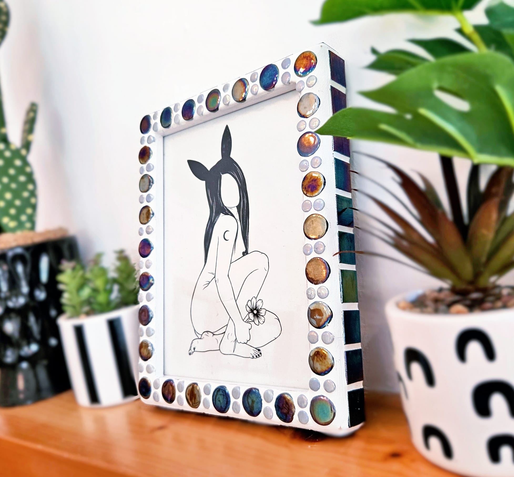 Iridescent mosaic photo-frame.