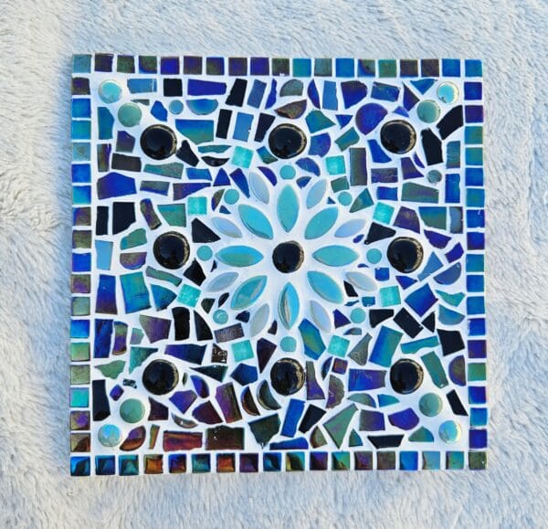 Turquoise mosaic flower tile.