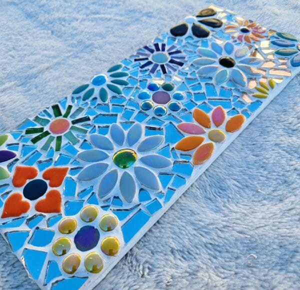 Mirrored mosaic flower tile.