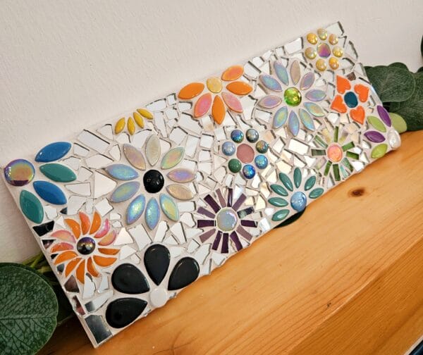 Mirrored mosaic flower tile.