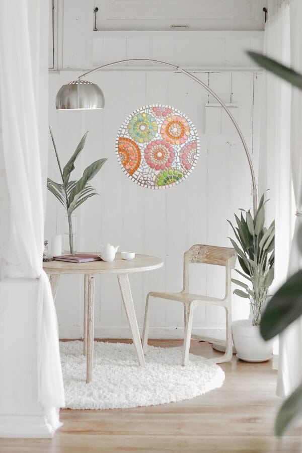 Bright, cozy, minimalist interior design with mosaic art.