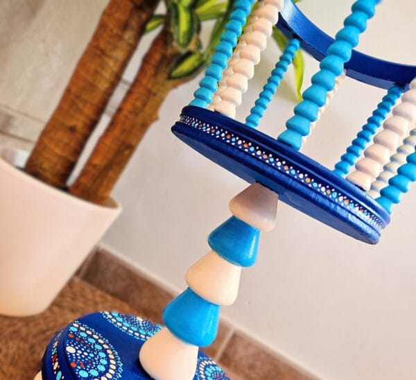 Blue and white painted plant stand.