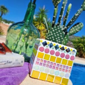 Yellow and pink decorative mosaic plant pot.