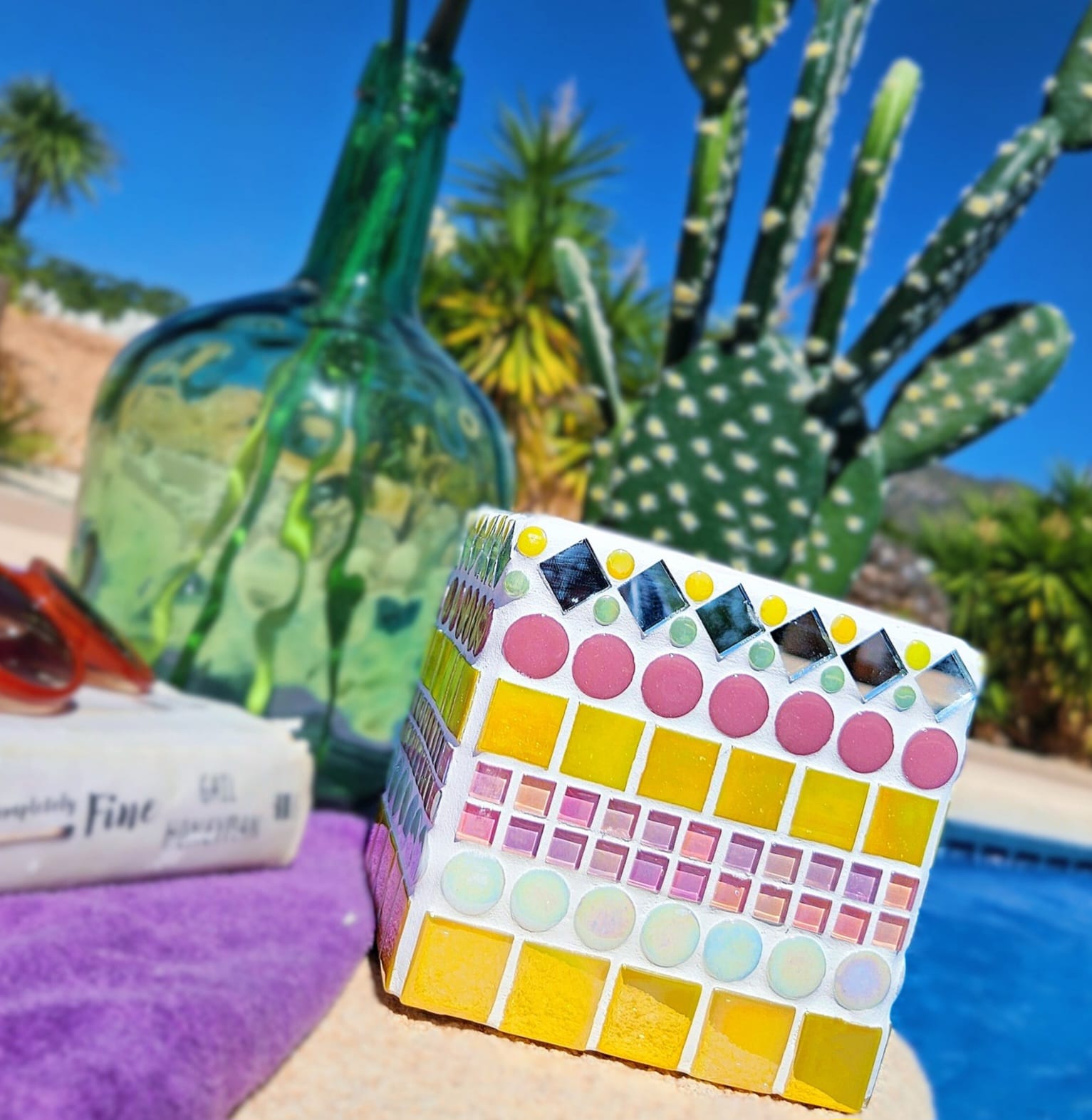 Yellow and pink decorative mosaic plant pot.