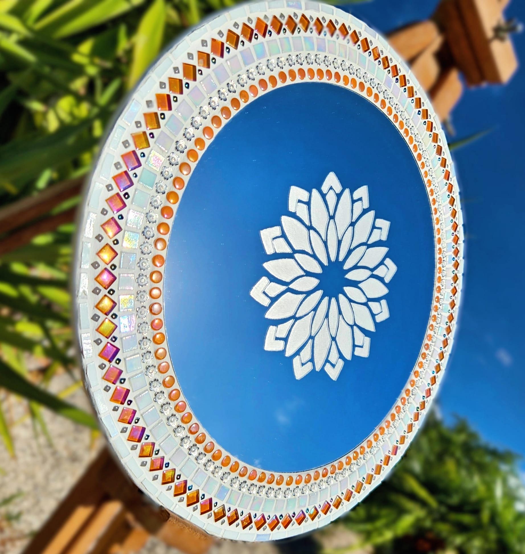 Mosaic mirror with etched design.