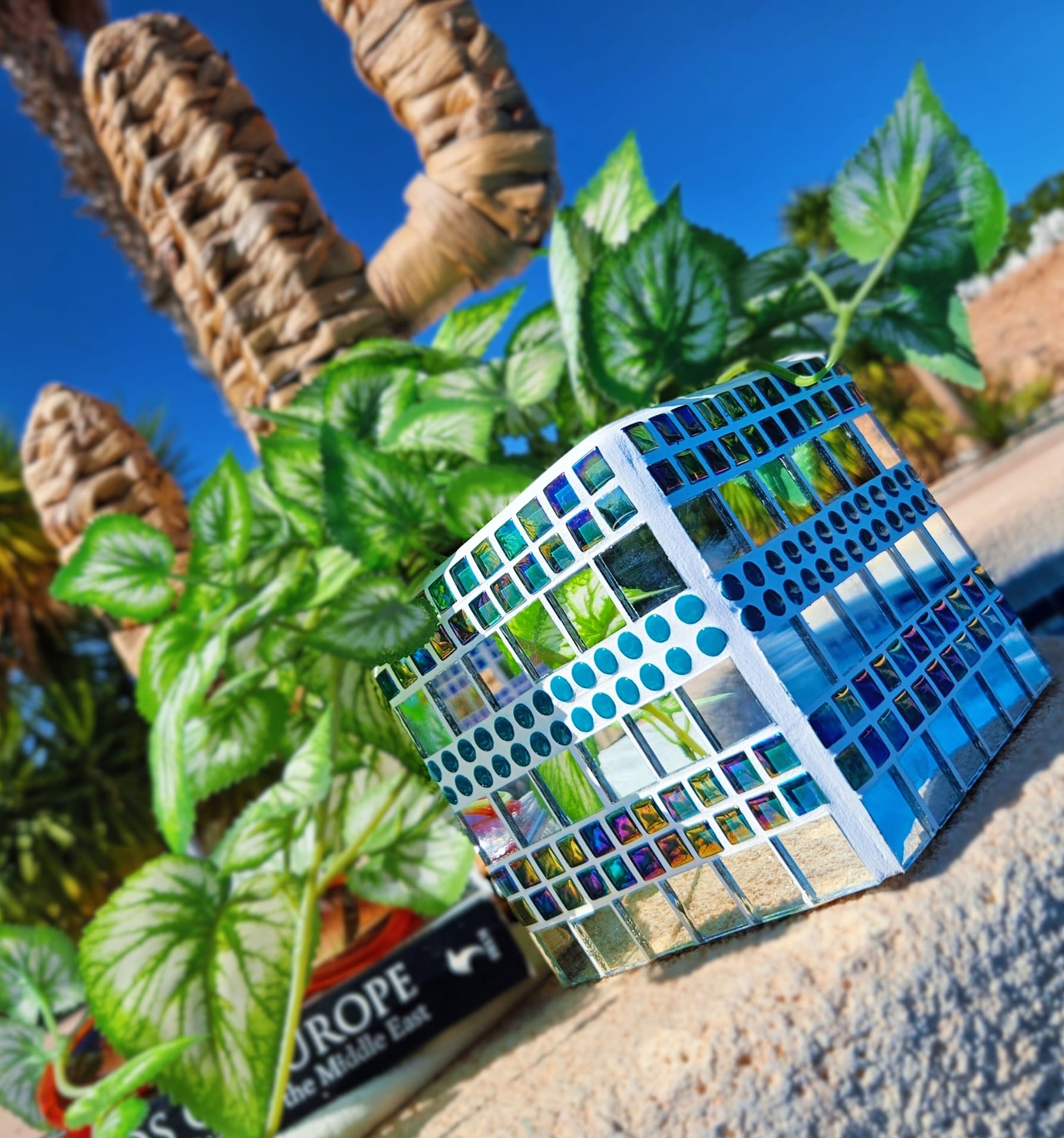 Turquoise decorative mosaic plant pot.