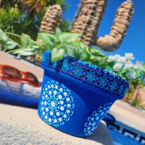 Dark blue dotted plant pot with Aztec trim.