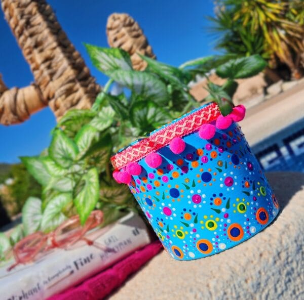 Pink and blue decorated plant pot.
