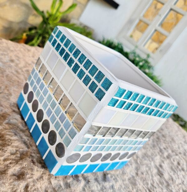 Decorative blue and white mosaic plant pot.