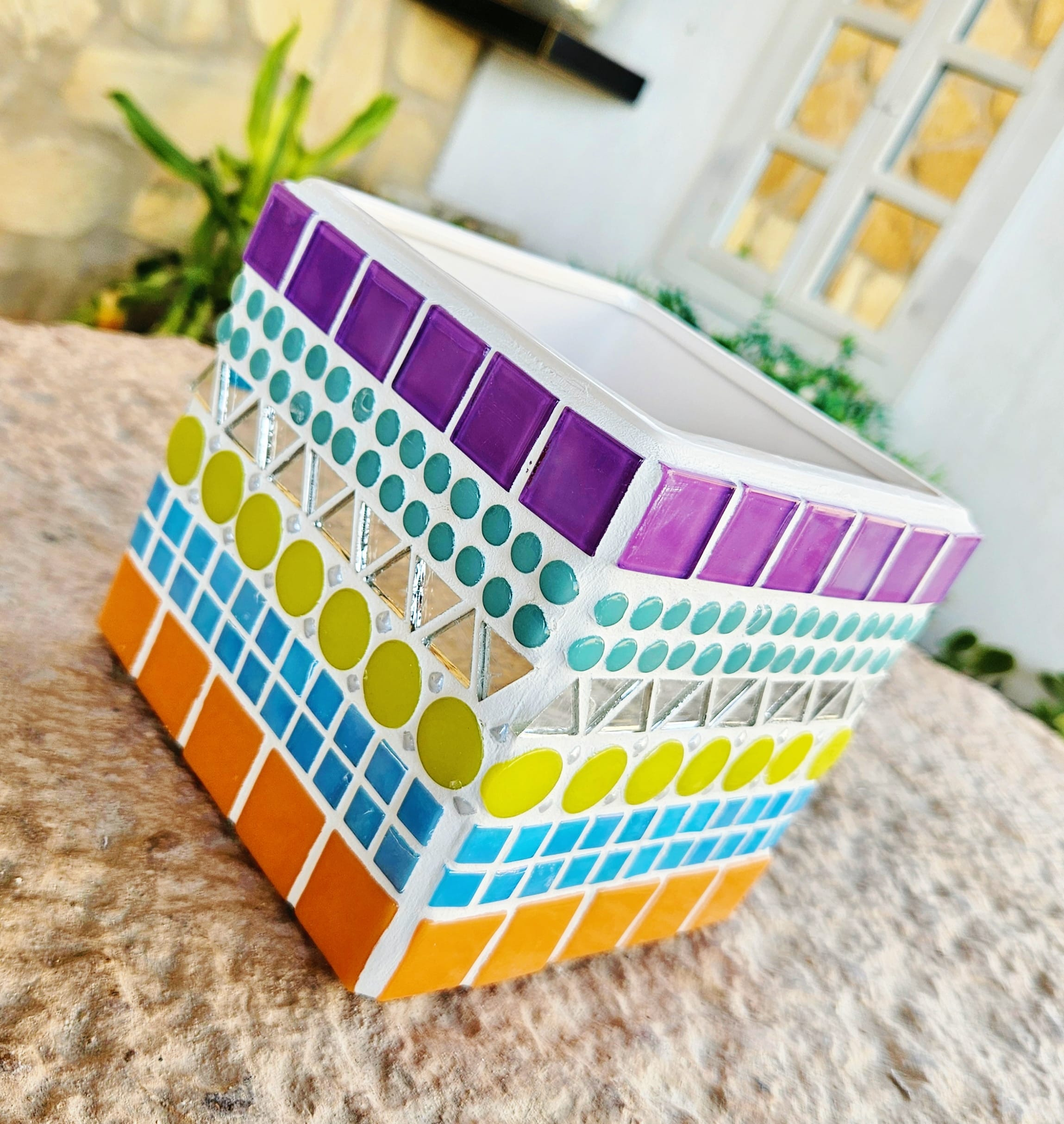 Decorative colourful mosaic plant pot.