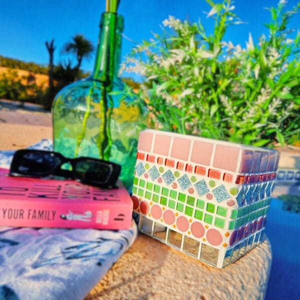 Decorative pink and green mosaic plant pot.