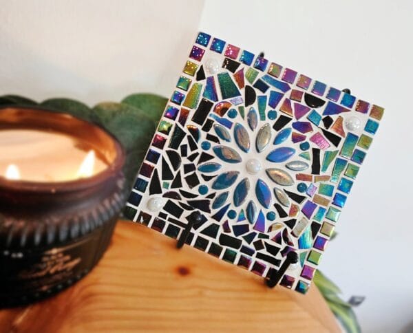 Colourful mosaic tile with turquoise flower.