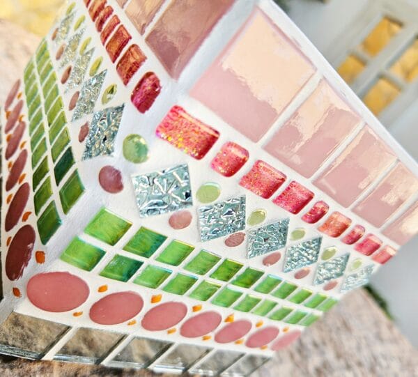 Decorative pink and green mosaic plant pot.