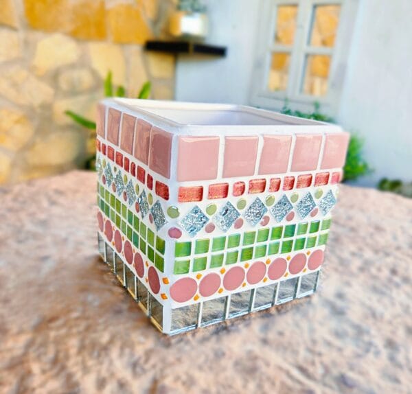 Decorative pink and green mosaic plant pot.