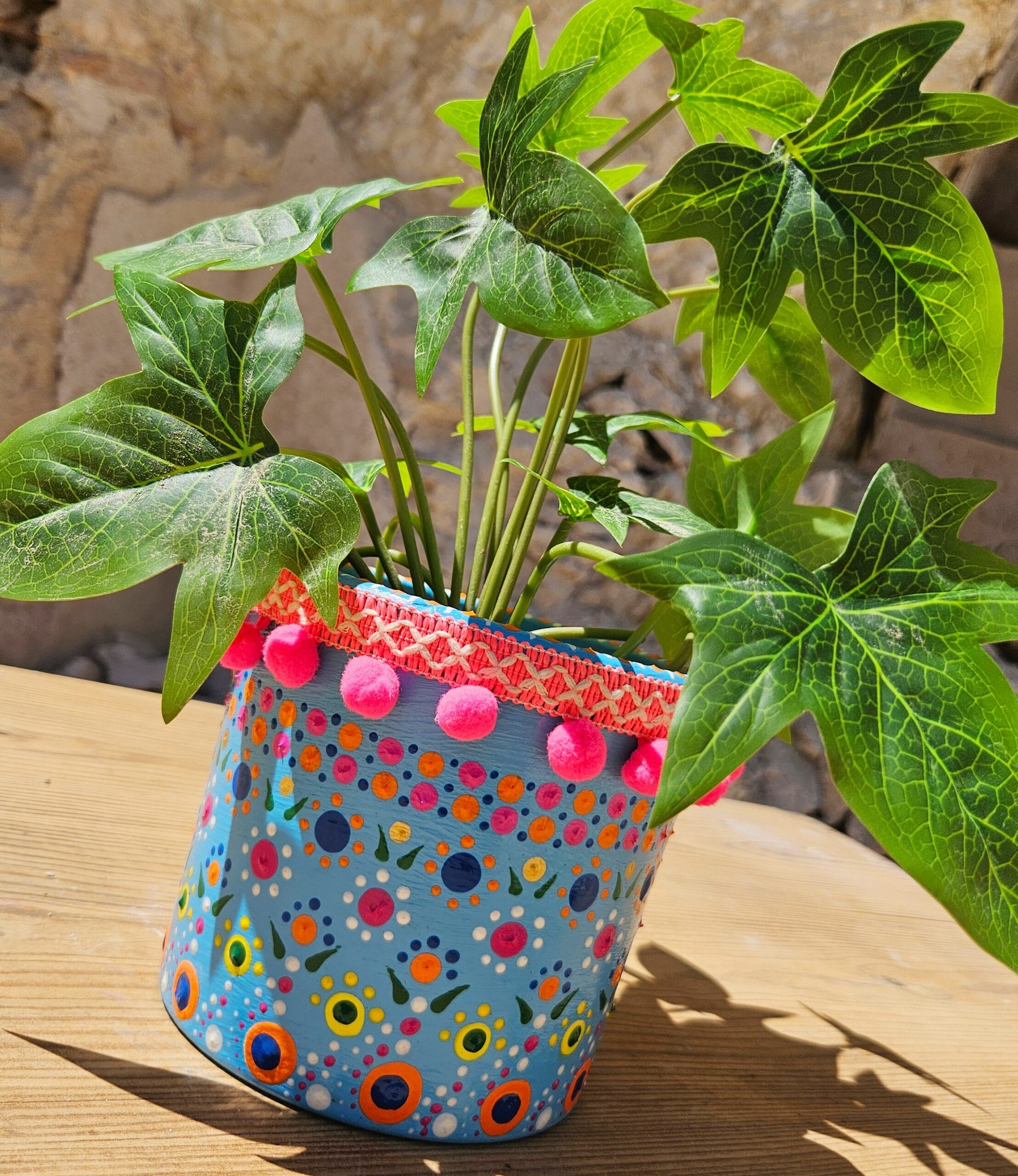 Blue and pink plant pot.