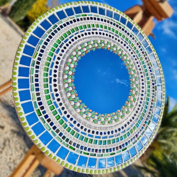 Mosaic mirror with painted dot work.