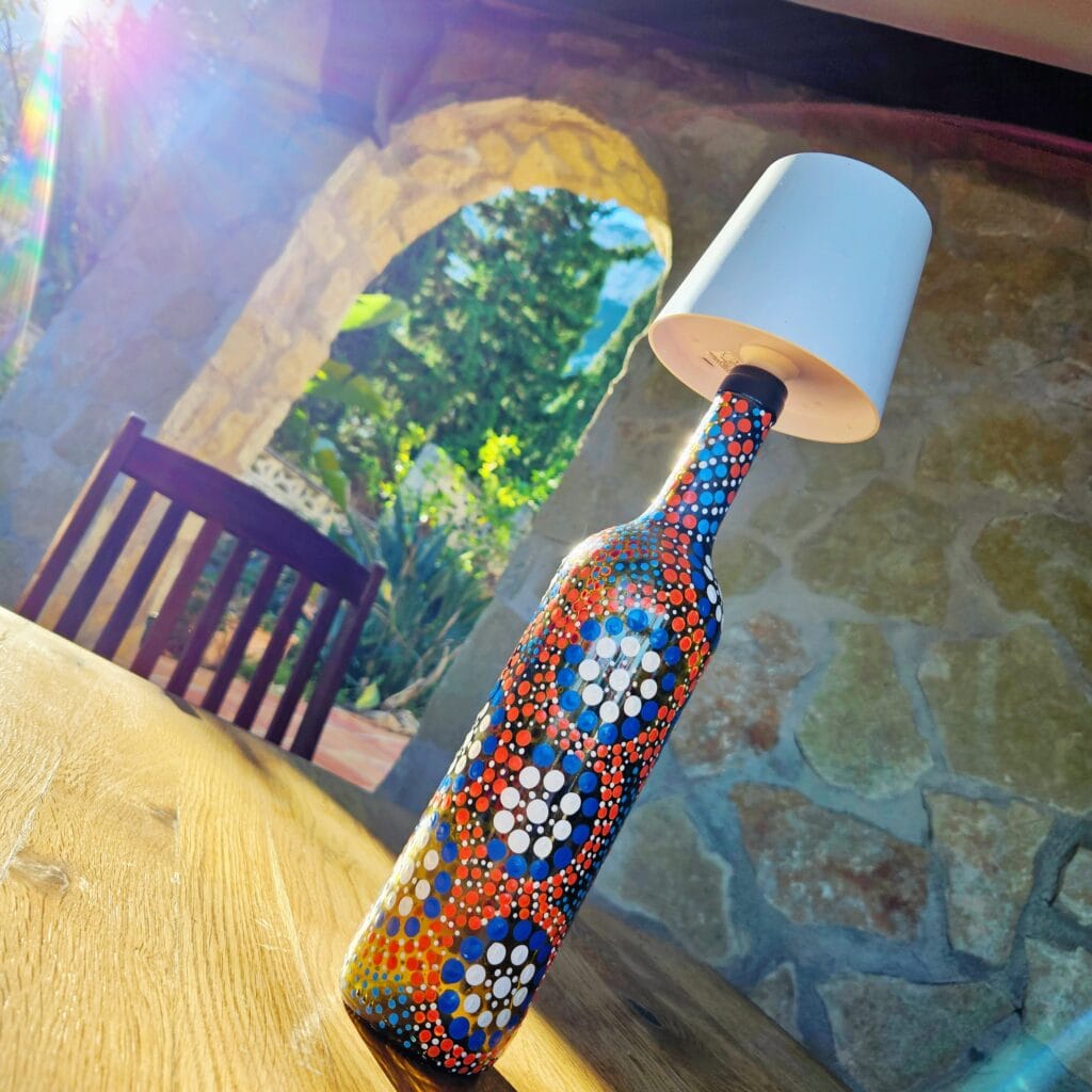 Dotted bottle lamp.